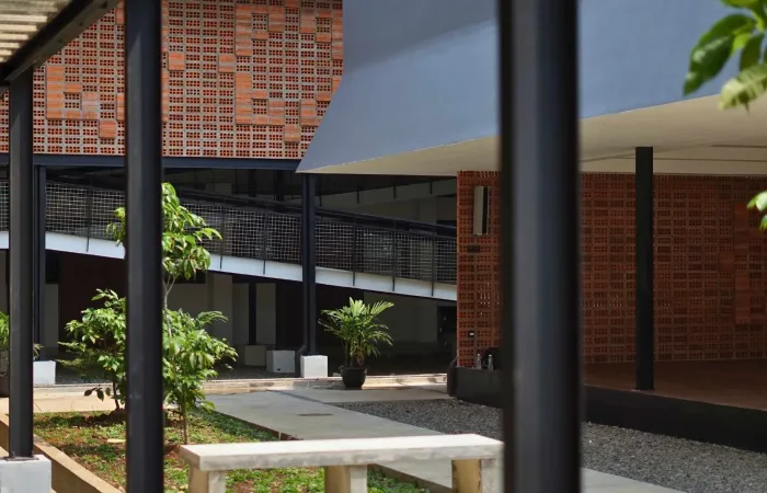 A sleek modern home with an exposed brick facade