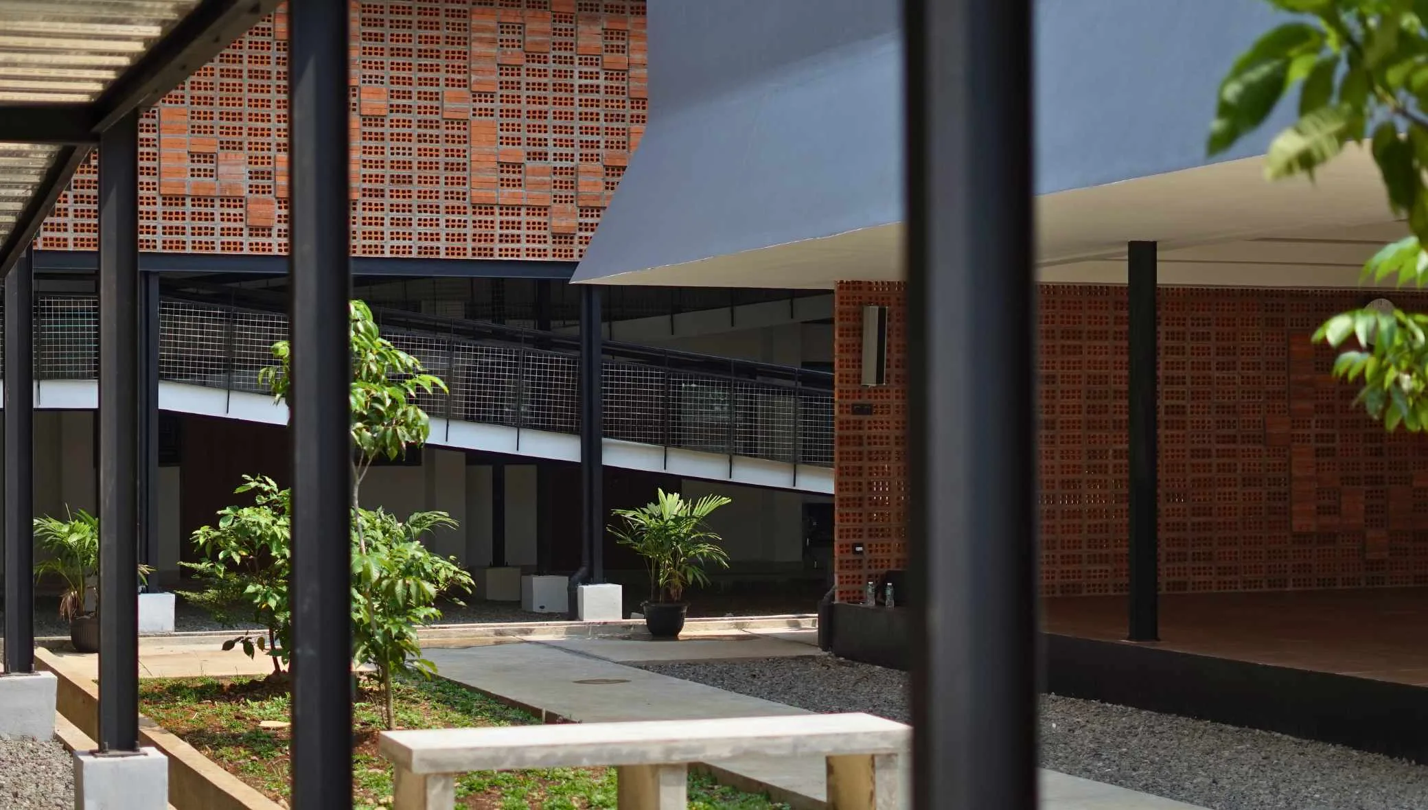 A sleek modern home with an exposed brick facade