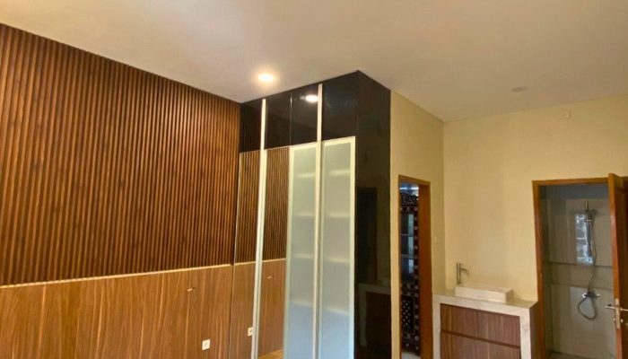 Exterior and interior views of CR House, a modern residential project in South Jakarta designed by YPA Architects, featuring an open layout, natural lighting, and contemporary materials.