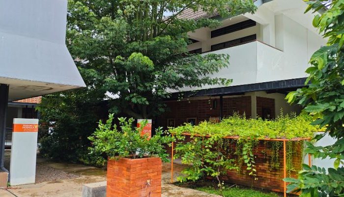 An inclusive Pesantren Tahfiz Difabel building designed for students with disabilities, featuring universal design principles such as accessible ramps, guiding blocks, and disability-friendly facilities.