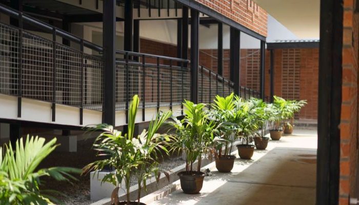 An inclusive Pesantren Tahfiz Difabel building designed for students with disabilities, featuring universal design principles such as accessible ramps, guiding blocks, and disability-friendly facilities.