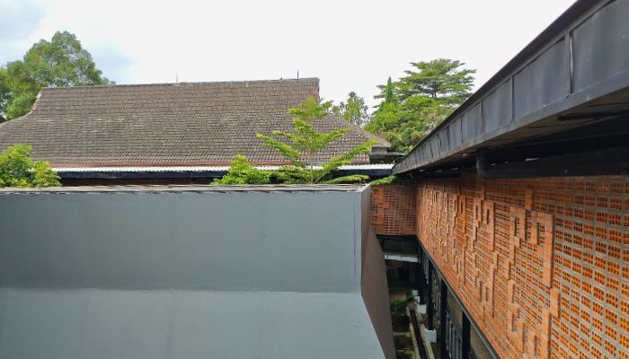 An inclusive Pesantren Tahfiz Difabel building designed for students with disabilities, featuring universal design principles such as accessible ramps, guiding blocks, and disability-friendly facilities.