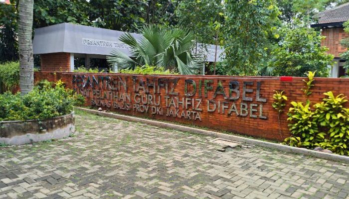 An inclusive Pesantren Tahfiz Difabel building designed for students with disabilities, featuring universal design principles such as accessible ramps, guiding blocks, and disability-friendly facilities.