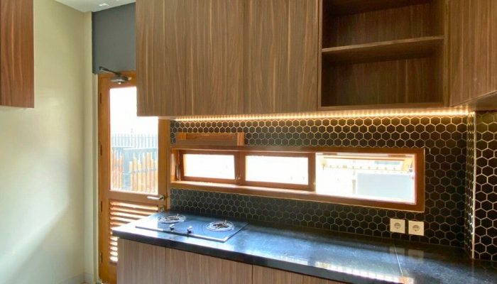 Exterior and interior views of CR House, a modern residential project in South Jakarta designed by YPA Architects, featuring an open layout, natural lighting, and contemporary materials.