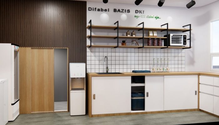 The interior of Cafe Difabis features a modern and inclusive design, incorporating wood elements and warm lighting. The ergonomic barista area is designed for accessibility, showcasing a professional coffee machine, open storage shelves, and a well-organized food display.