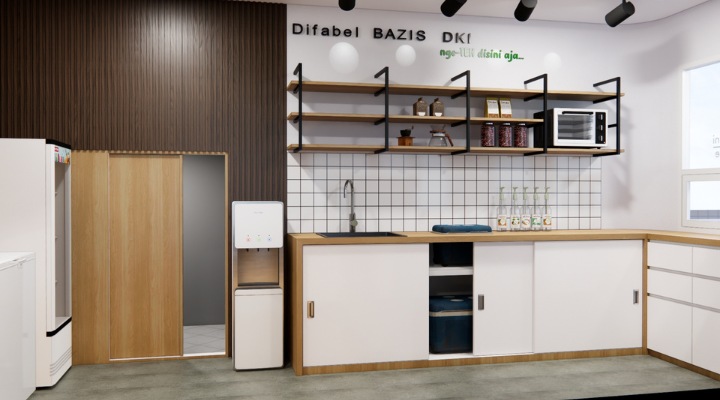 The interior of Cafe Difabis features a modern and inclusive design, incorporating wood elements and warm lighting. The ergonomic barista area is designed for accessibility, showcasing a professional coffee machine, open storage shelves, and a well-organized food display.