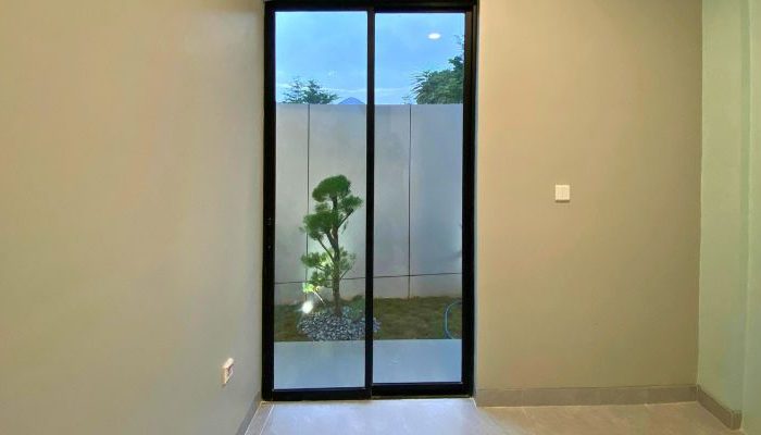 Modern contemporary house with clean lines, neutral tones, and efficient massing on a compact site in Cileungsi, Bogor – JPN House by YPA Architecture