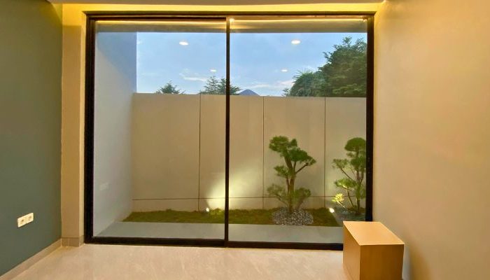 Modern contemporary house with clean lines, neutral tones, and efficient massing on a compact site in Cileungsi, Bogor – JPN House by YPA Architecture