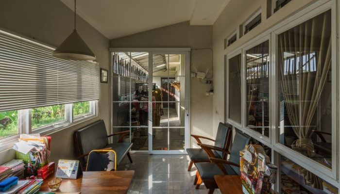 Modern residential and industrial buildings in Purbalingga featuring traditional red brick gates and tropical industrial design by YPA Architecture Studio in 2024.