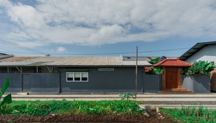 Modern residential and industrial buildings in Purbalingga featuring traditional red brick gates and tropical industrial design by YPA Architecture Studio in 2024.