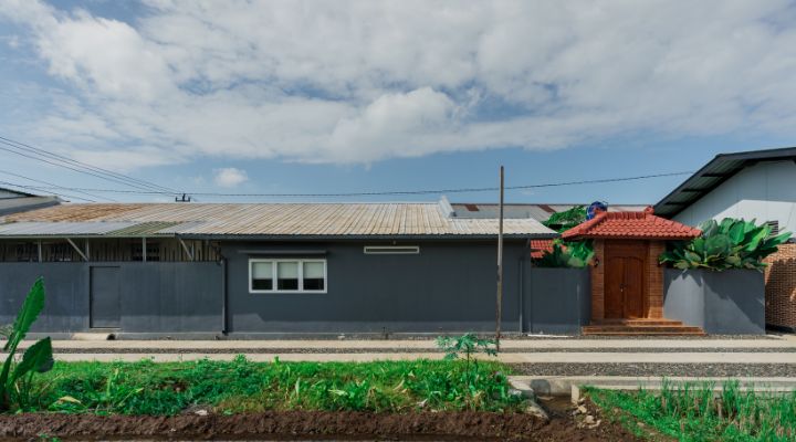 Modern residential and industrial buildings in Purbalingga featuring traditional red brick gates and tropical industrial design by YPA Architecture Studio in 2024.