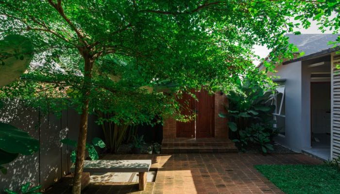 Modern residential and industrial buildings in Purbalingga featuring traditional red brick gates and tropical industrial design by YPA Architecture Studio in 2024.