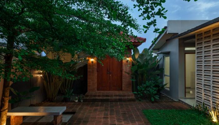 Modern residential and industrial buildings in Purbalingga featuring traditional red brick gates and tropical industrial design by YPA Architecture Studio in 2024.