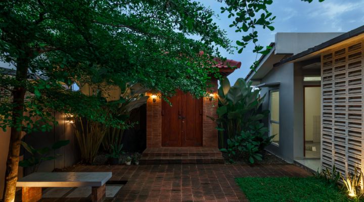 Modern residential and industrial buildings in Purbalingga featuring traditional red brick gates and tropical industrial design by YPA Architecture Studio in 2024.