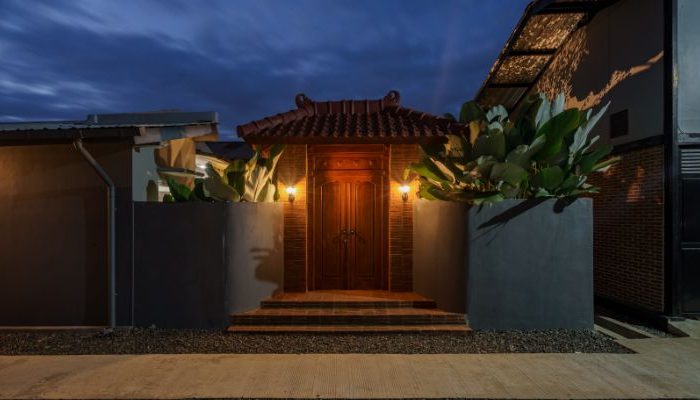 Modern residential and industrial buildings in Purbalingga featuring traditional red brick gates and tropical industrial design by YPA Architecture Studio in 2024.