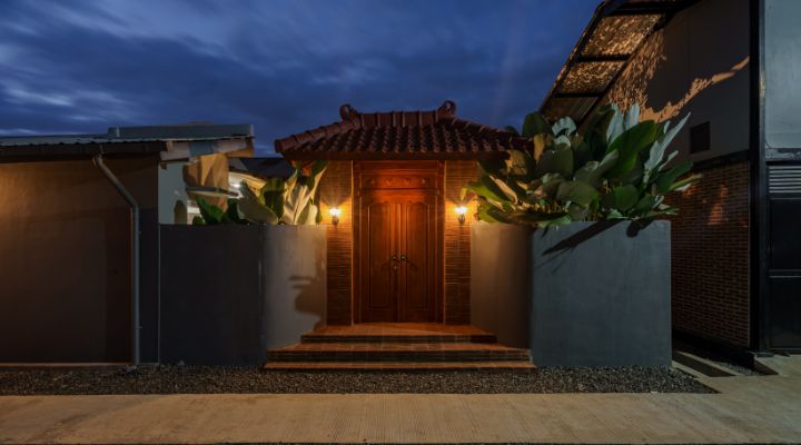 Modern residential and industrial buildings in Purbalingga featuring traditional red brick gates and tropical industrial design by YPA Architecture Studio in 2024.