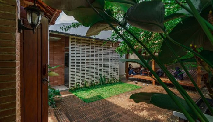 Modern residential and industrial buildings in Purbalingga featuring traditional red brick gates and tropical industrial design by YPA Architecture Studio in 2024.