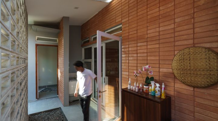 Modern residential and industrial buildings in Purbalingga featuring traditional red brick gates and tropical industrial design by YPA Architecture Studio in 2024.