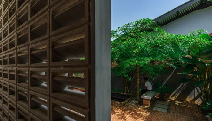 Modern residential and industrial buildings in Purbalingga featuring traditional red brick gates and tropical industrial design by YPA Architecture Studio in 2024.