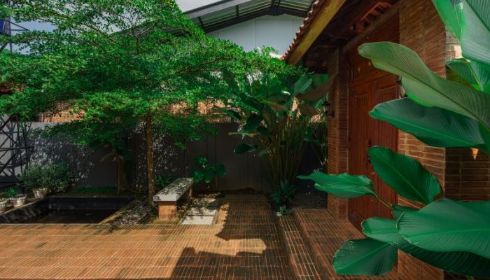 Modern residential and industrial buildings in Purbalingga featuring traditional red brick gates and tropical industrial design by YPA Architecture Studio in 2024.