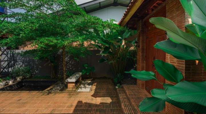 Modern residential and industrial buildings in Purbalingga featuring traditional red brick gates and tropical industrial design by YPA Architecture Studio in 2024.