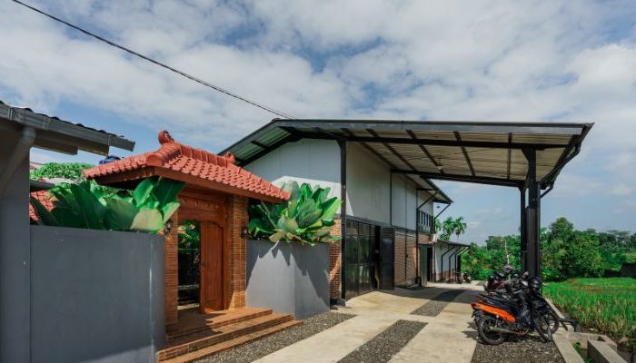 Modern residential and industrial buildings in Purbalingga featuring traditional red brick gates and tropical industrial design by YPA Architecture Studio in 2024.