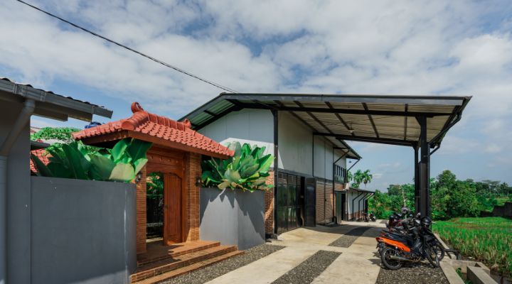 Modern residential and industrial buildings in Purbalingga featuring traditional red brick gates and tropical industrial design by YPA Architecture Studio in 2024.