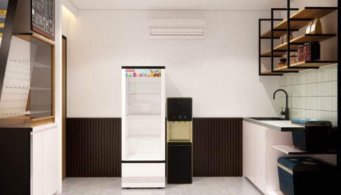 The exterior and interior design of Cafe Difabis RSUD Kebayoran Lama by YPA Architecture Studio features a small building with a transparent canopy, open seating area, and inclusive layout that is disability friendly.