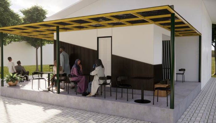 The exterior and interior design of Cafe Difabis RSUD Kebayoran Lama by YPA Architecture Studio features a small building with a transparent canopy, open seating area, and inclusive layout that is disability friendly.