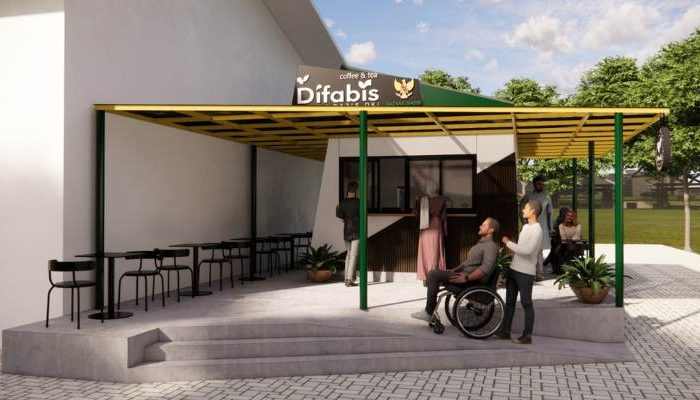 The exterior and interior design of Cafe Difabis RSUD Kebayoran Lama by YPA Architecture Studio features a small building with a transparent canopy, open seating area, and inclusive layout that is disability friendly.