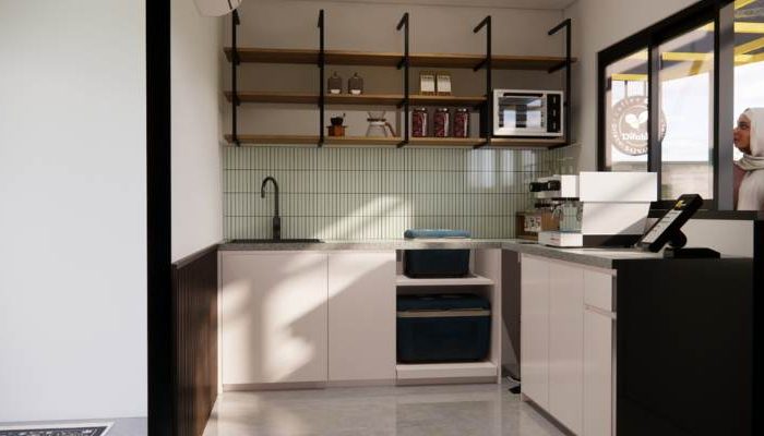 The exterior and interior design of Cafe Difabis RSUD Kebayoran Lama by YPA Architecture Studio features a small building with a transparent canopy, open seating area, and inclusive layout that is disability friendly.