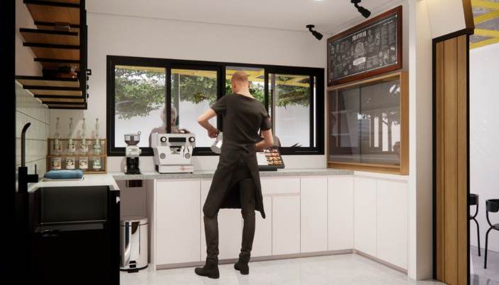 The exterior and interior design of Cafe Difabis RSUD Kebayoran Lama by YPA Architecture Studio features a small building with a transparent canopy, open seating area, and inclusive layout that is disability friendly.